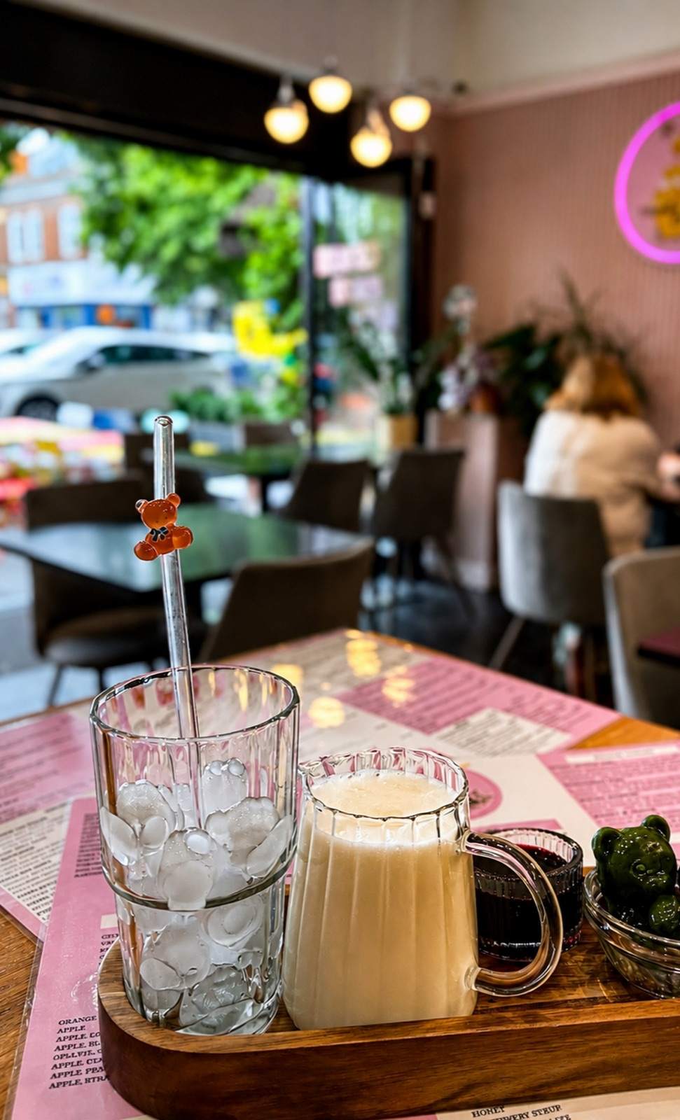 Drinks served on a wooden tray inside Honey & Cream